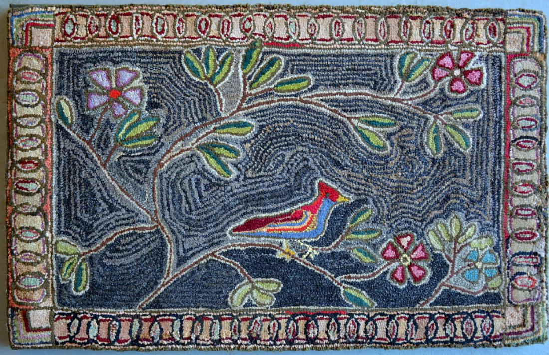 Folk art hooked rug depicting a cardinal bird perched (1 of 3)