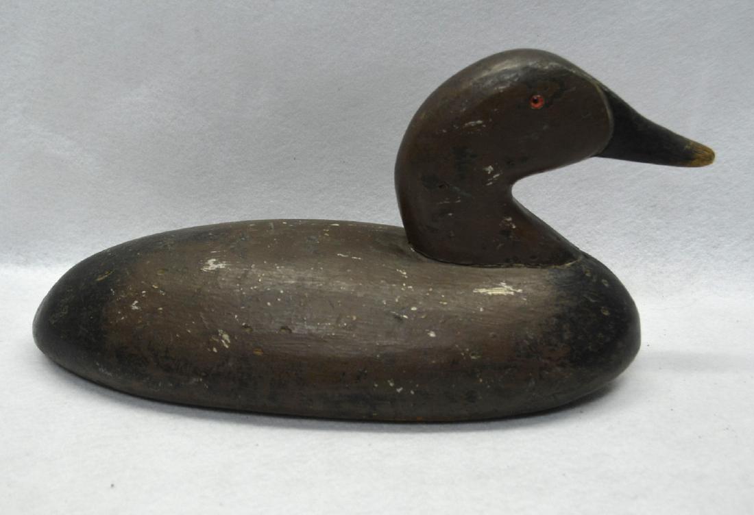 Old wooden duck decoy in brown and black paint which (1 of 5)