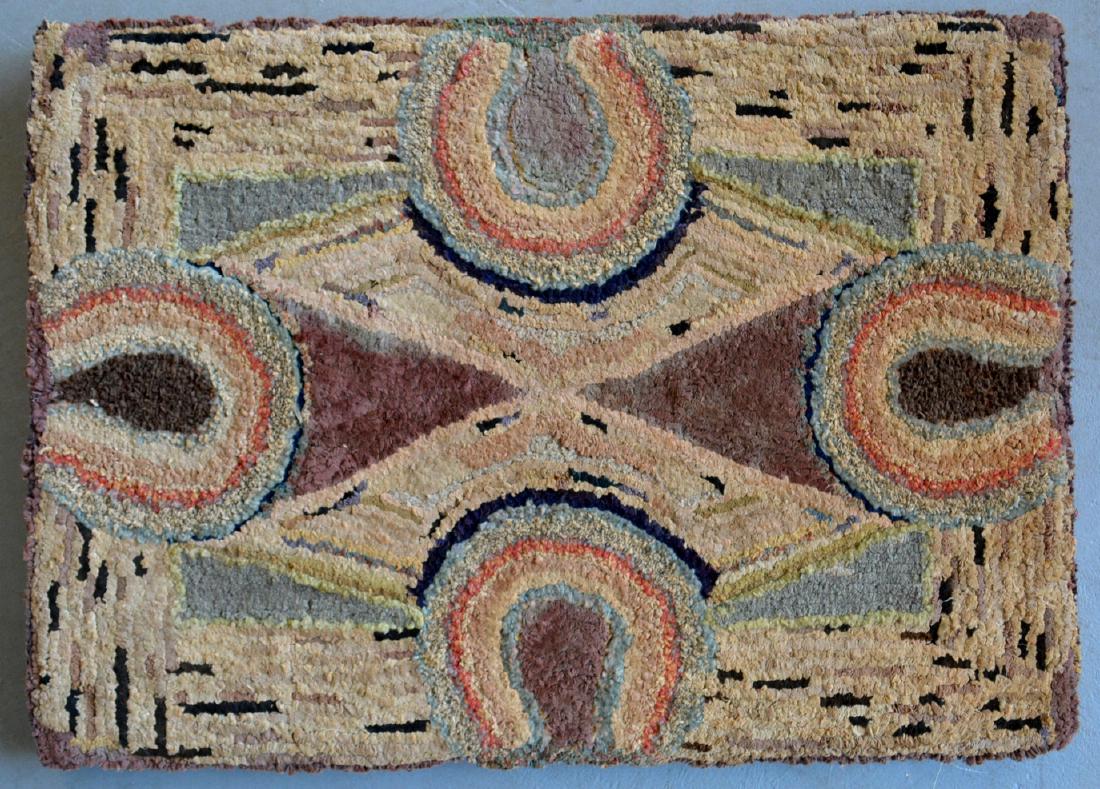 Hooked rug decorated with horseshoes and geometric (1 of 2)