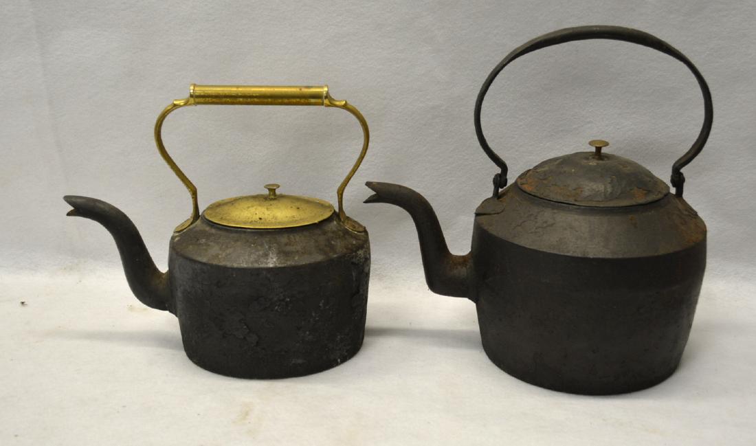 Two early cast iron tea kettles including one with (1 of 2)