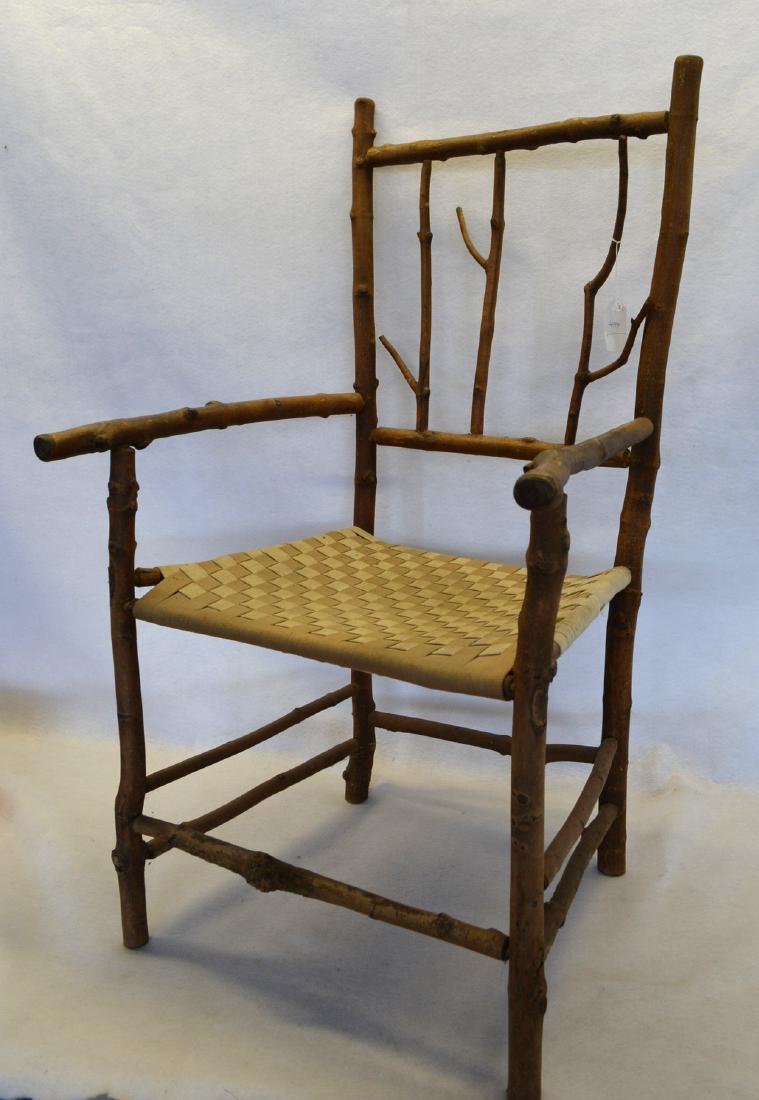 Rustic twig arm chair with woven tape seat. Probably (1 of 1)