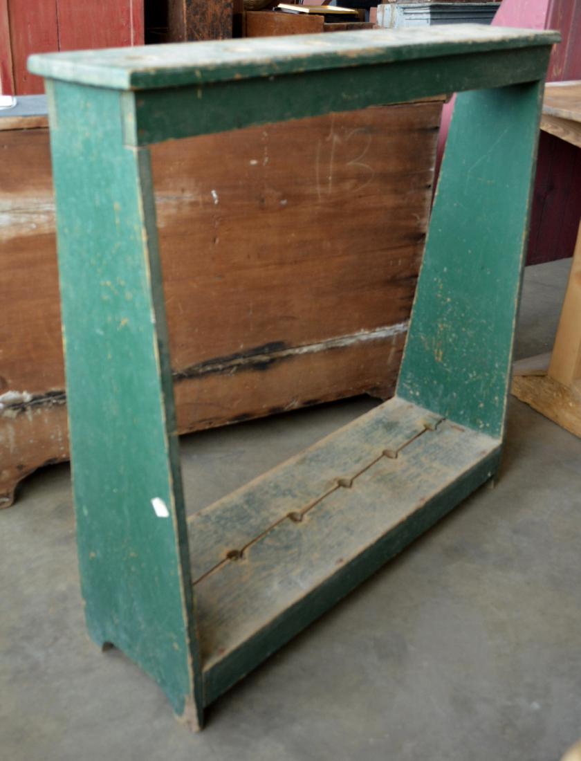 Primitive floor standing broom rack in original green (1 of 2)