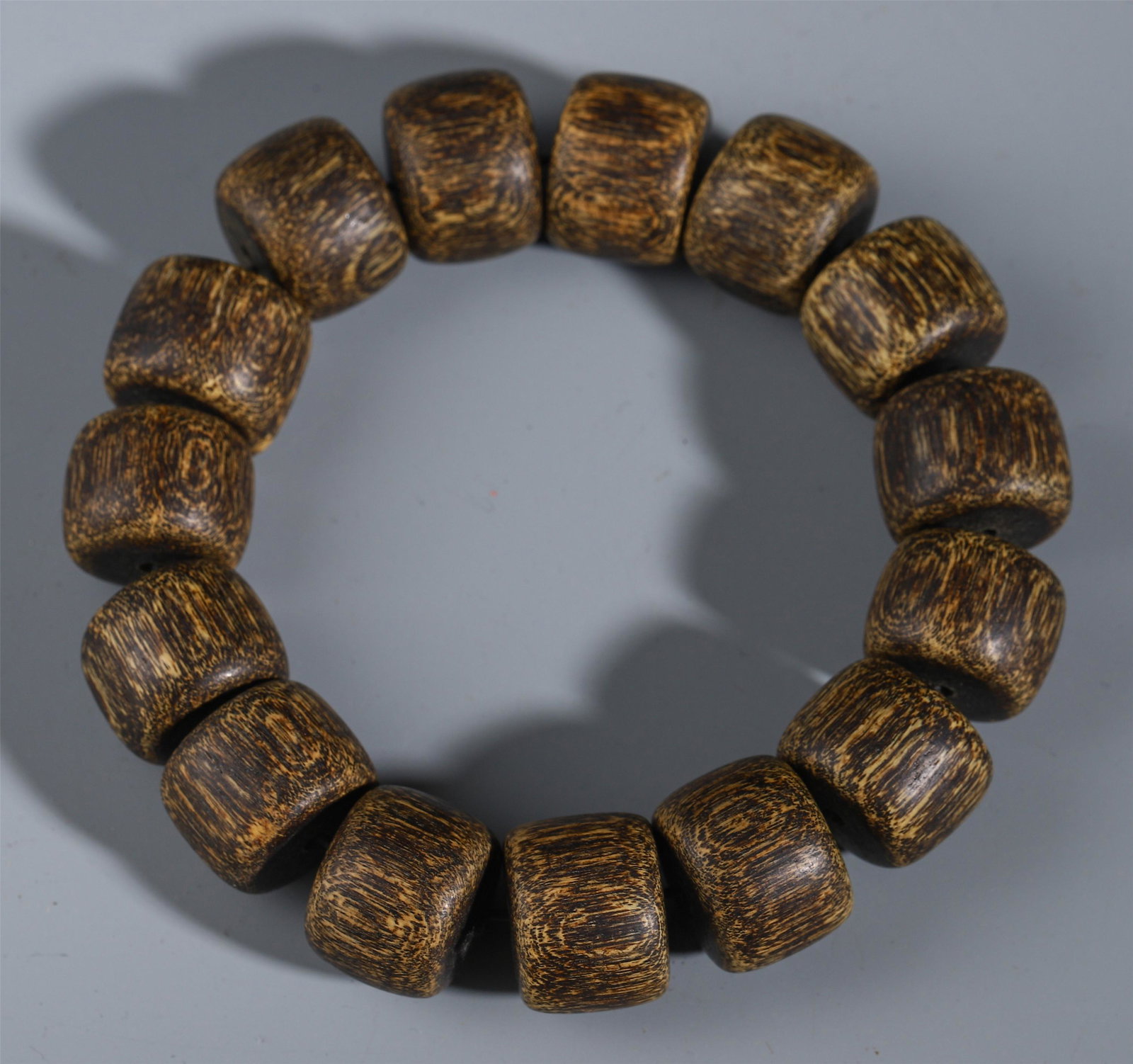 A CHINESE AGALWOOD CARVED BEAD BUDDHIST BRACELET: Diam. 1.7 cm. Weight 40 gram.