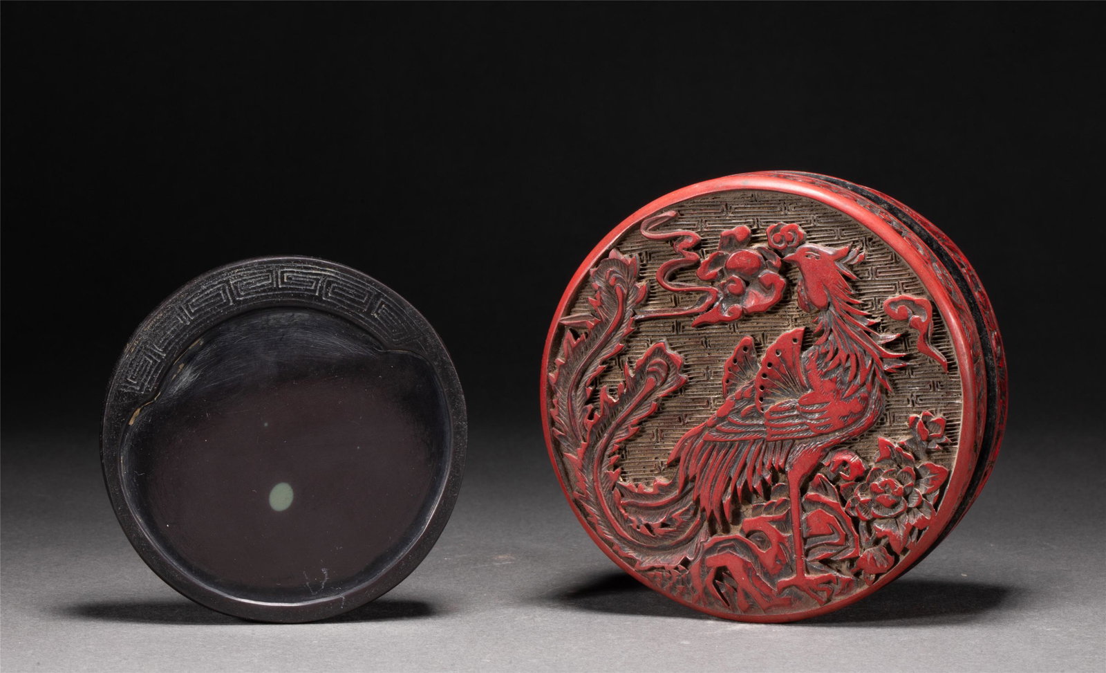 A CHINESE ROUND INKSTONE: W. 10 cm. H. 4 cm. Weight 460 gram.
