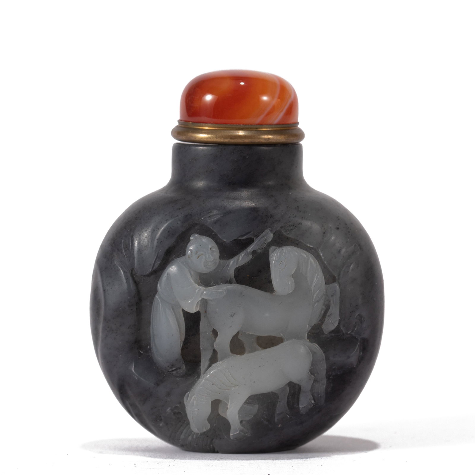 A CARVED FIGURE AND HORSES SNUFF BOTTLE: L. 5.5 cm. W. 3.5 cm. H. 7 cm. Weight 120 gram.