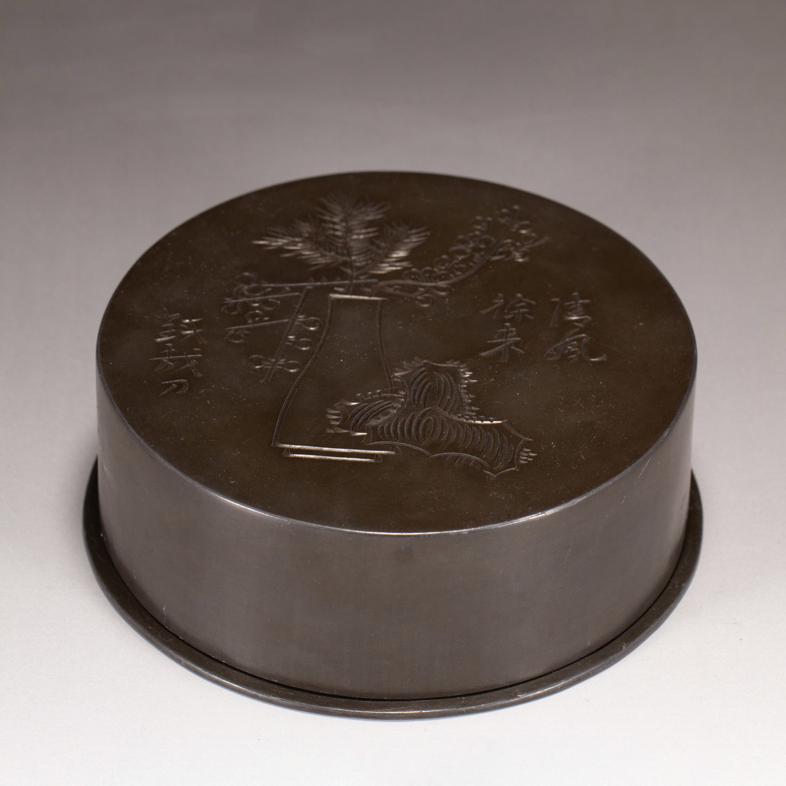 A CHINESE TIN LIDDED BOX: L. 12.5 cm. W. 12.5 cm. H. 4.5 cm. Weight 1030 grams.