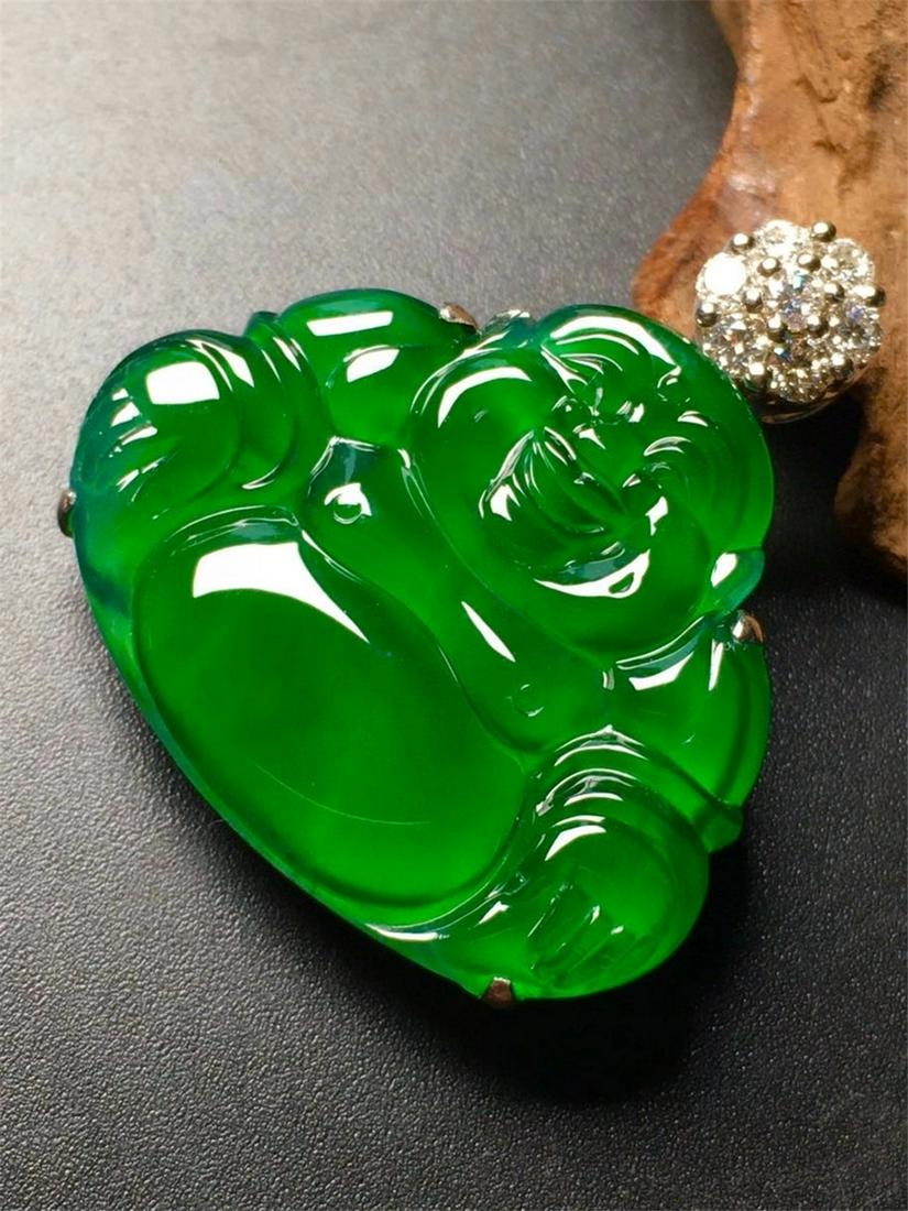 A Chinese Carved Jadeite Pendant (W/O Chain): Ht. 26.7mm, Wd. 21.4mm