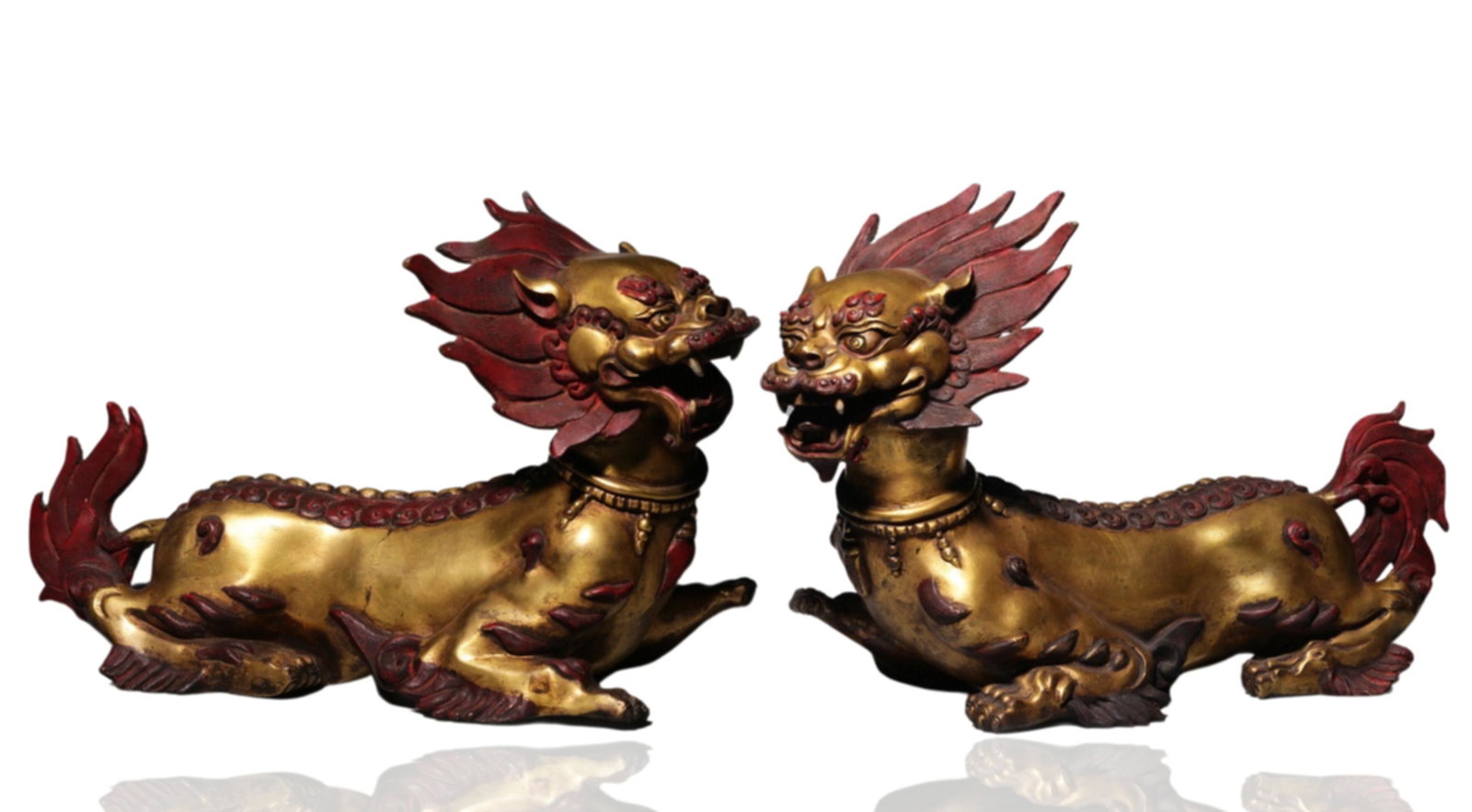 A Pair of Chinese Gilt Bronze Foo Dogs: A Pair of Chinese Gilt Bronze Foo Dogs ï¼Œ Ht. 27cm, Lg. 42cm, Wd. 17cm