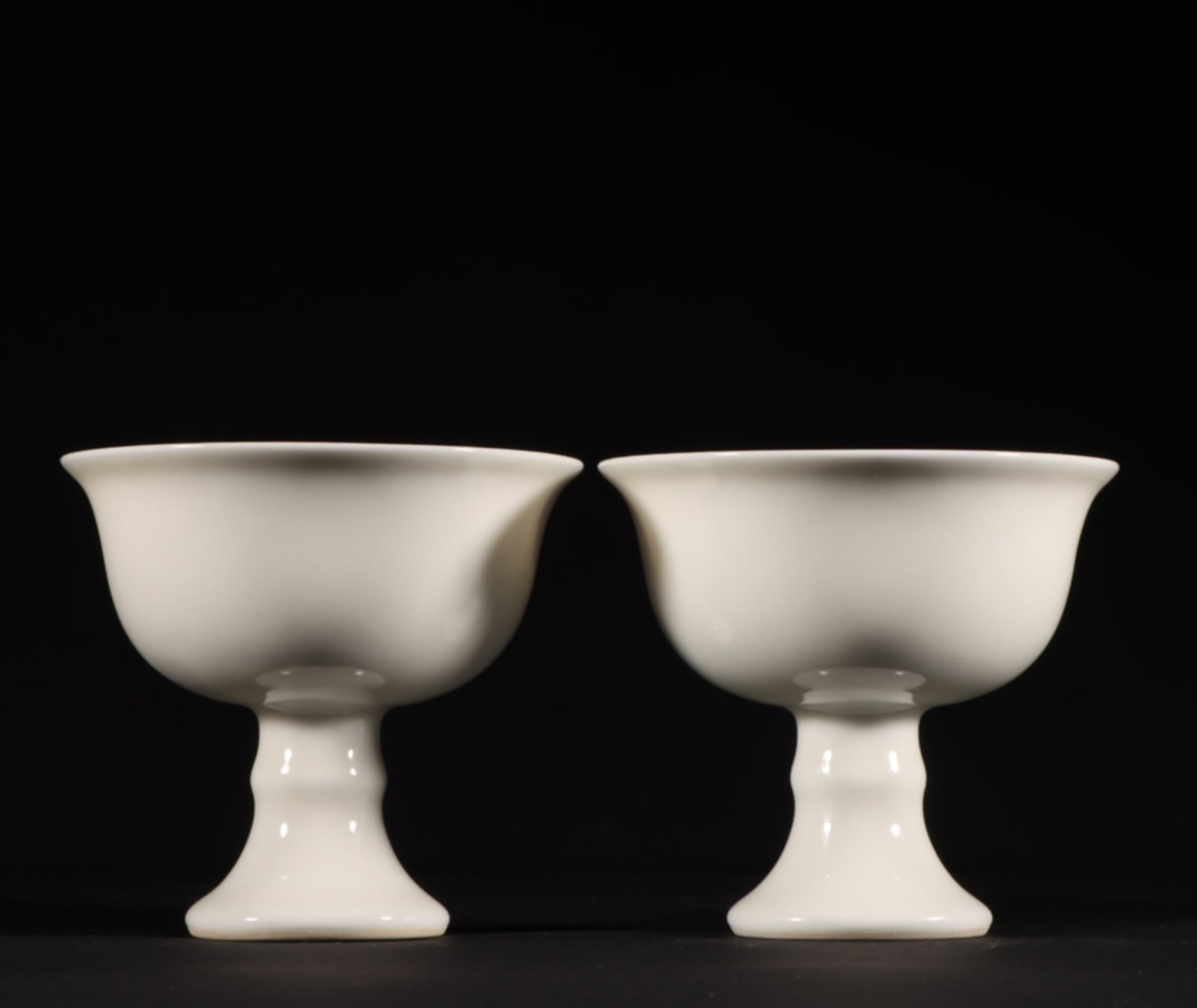 A Pair of Chinese White Glazed Porcelain Stem Cups: A Pair of Chinese White Glazed Porcelain Stem Cups. Ht.7cm Wd.8cm