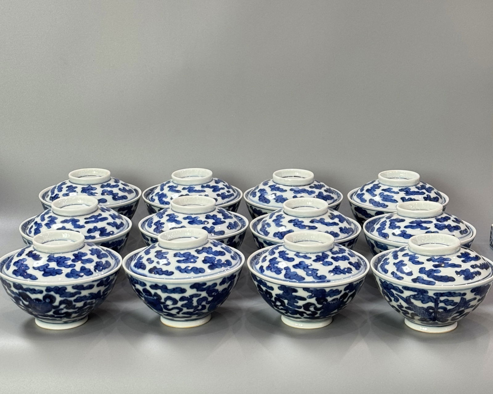Set of Twelve Blue and White Tea Cups and Covers: Set of Twelve Blue and White Tea Cups and Covers. Ht.6.8cm Wd.12cm