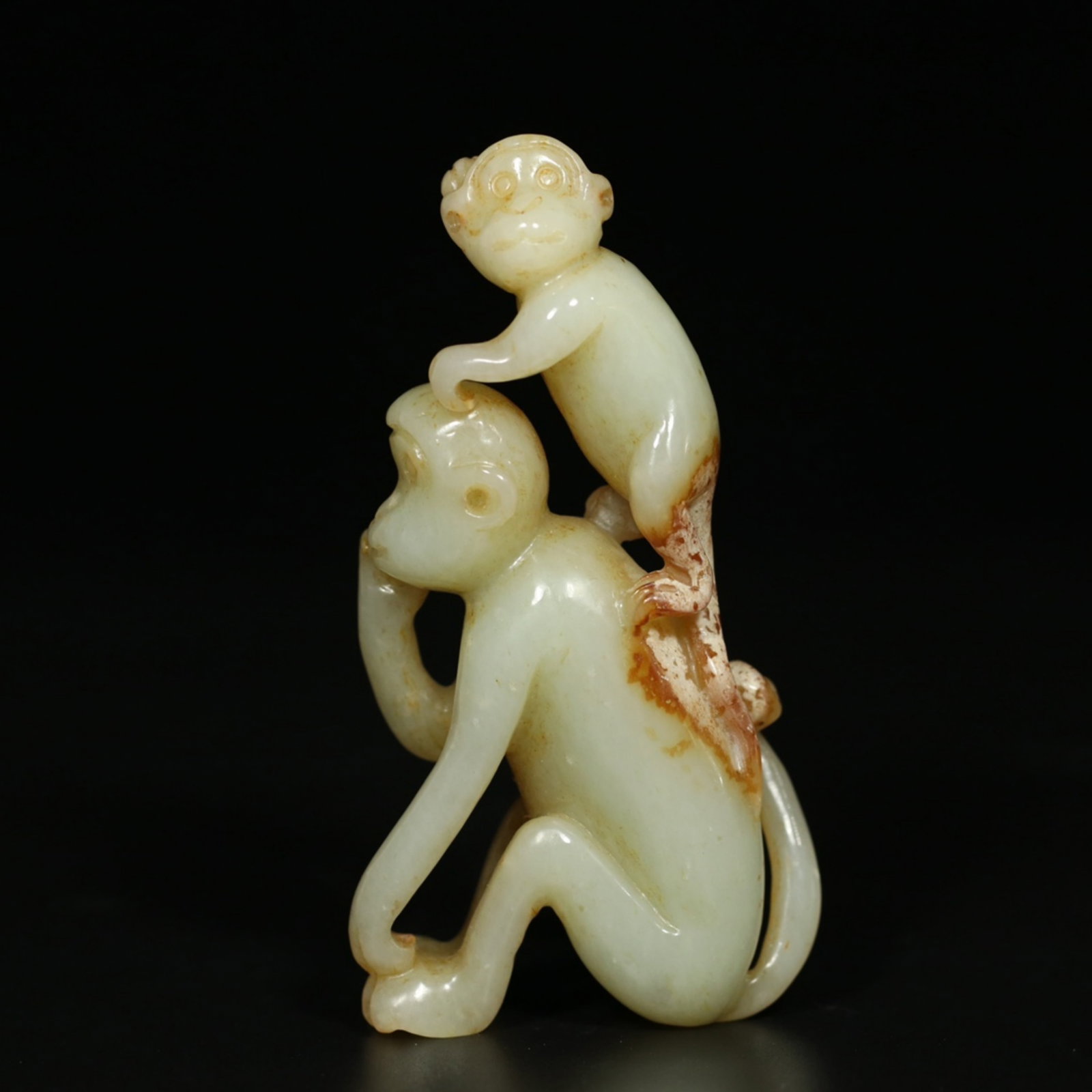 A Chinese Carved Jade Monkeys Statuette: A Chinese Carved Jade Monkeys Statuette. Ht.8.5cm Wd.4.5cm Wt.76.3g