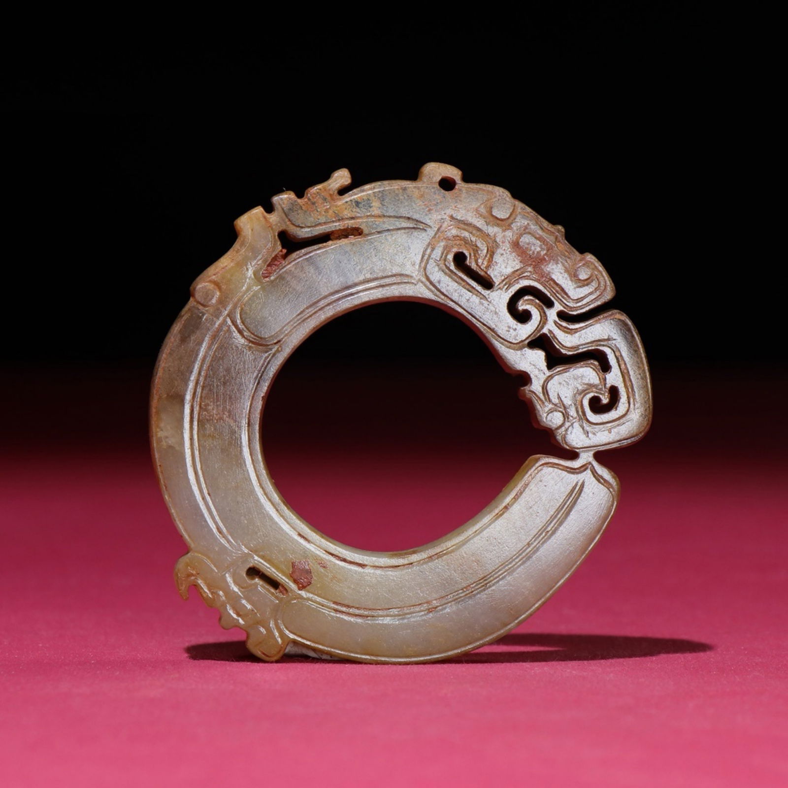 A Chinese Carved Jade Dragon Ring Pendant: A Chinese Carved Jade Dragon Ring Pendant. Diam. 6.4cm, Ht. 0.5cm, Wt. 37g