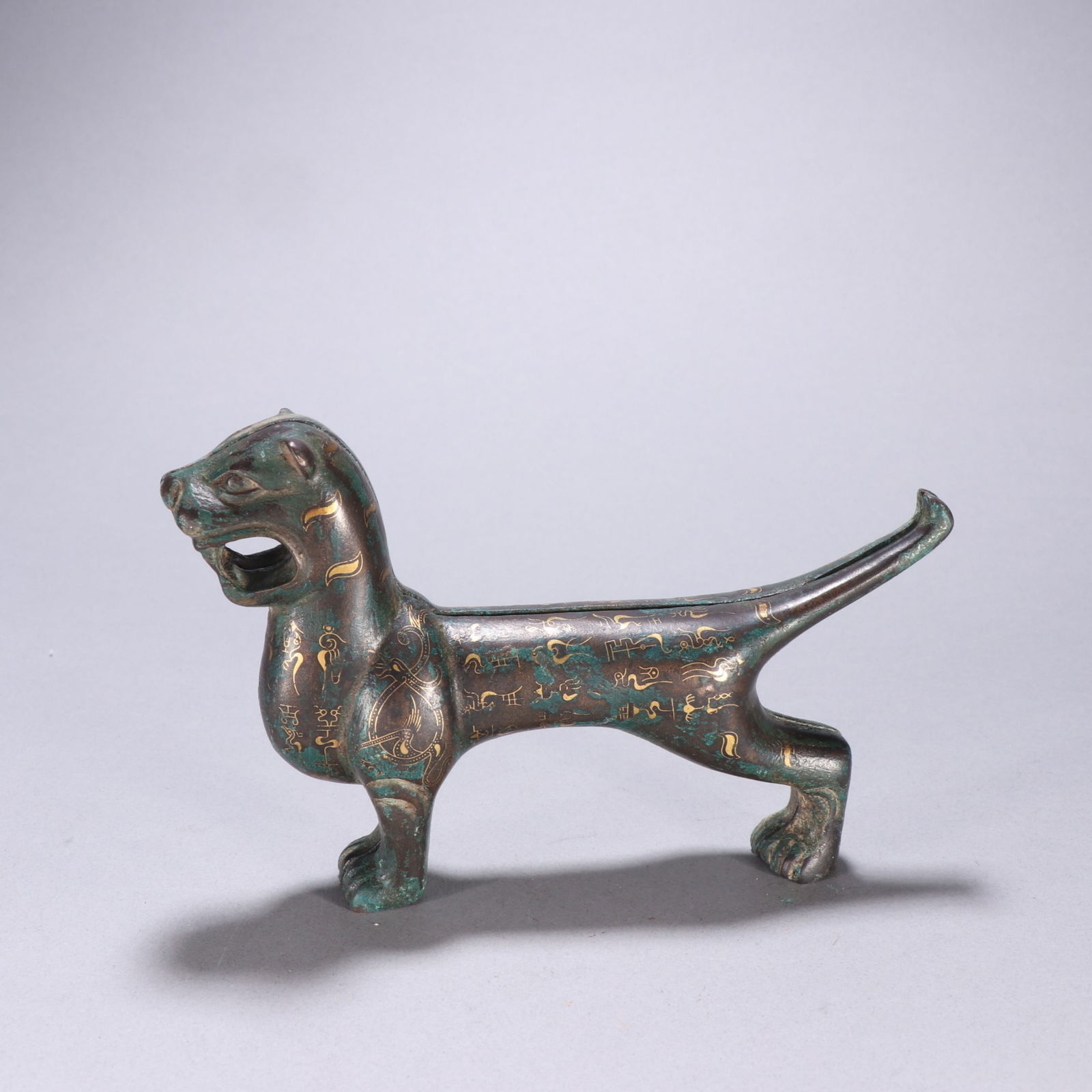 A Chinese Bronze Tiger Statuette with Silver Inlaid: A Chinese Bronze Tiger Statuette with Silver Inlaid. Ht. 10.7cm, Wd. 17cm, Wt. 1233.4g