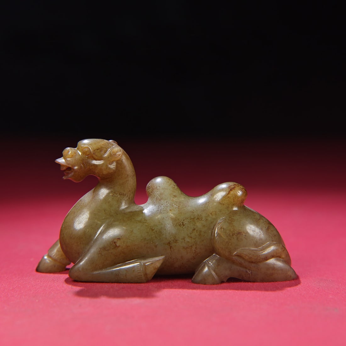 A Chinese Carved Jade Camel Statuette: A Chinese Carved Jade Camel Statuette. Lg. 10cm, Wd. 3.3cm, Ht. 5.3cm, Wt. 193g