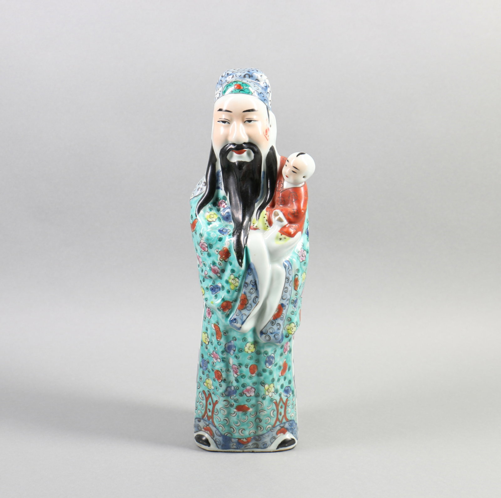 A Chinese Famille-Rose Porcelain Figure Statue of Man hold Child: A Chinese Famille-Rose Porcelain Figure Statue of Man hold Child . Ht. 40cm