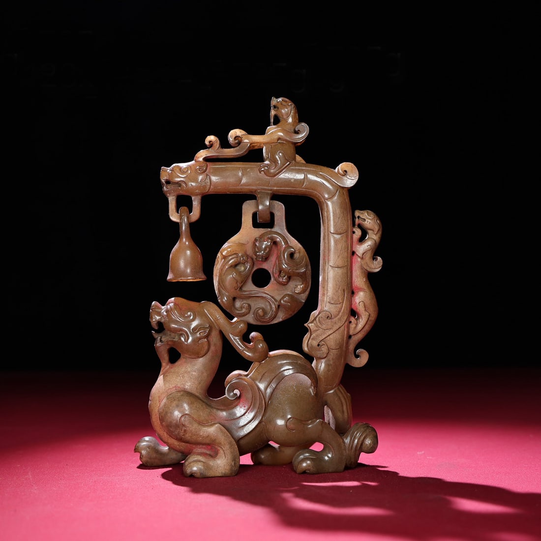 A Chinese Carved Jade Foo-Dog Statuette: A Chinese Carved Jade Foo-Dog Statuette. Ht. 19.4cm, Wd. 12.8cm, Th. 4.6cm, Wt. 725g