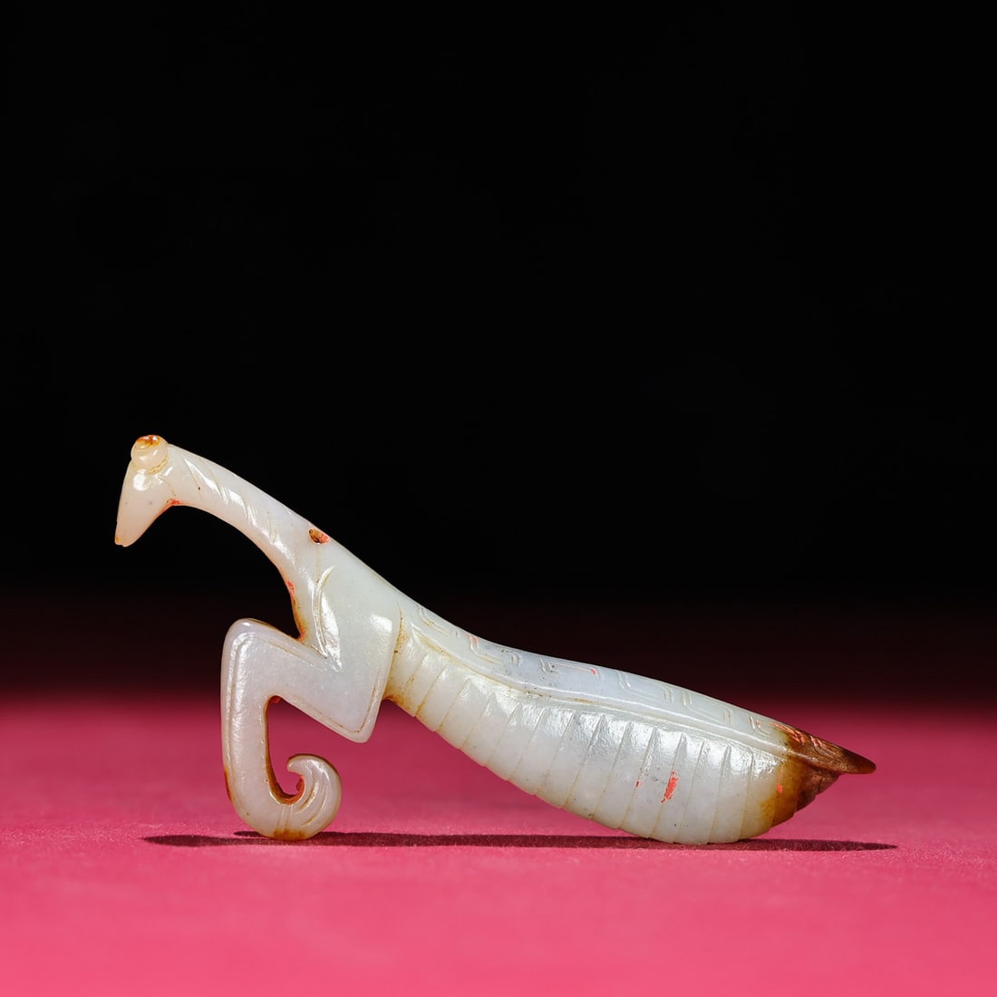A Chinese Carved Jade Mantis Statuette: A Chinese Carved Jade Mantis Statuette. Lg. 10.2cm, Wd. 3.6cm, Th. 1.3cm, Wt. 46g