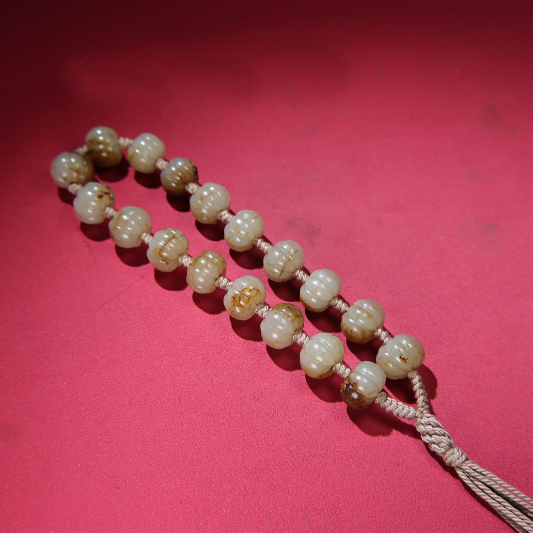 A Chinese Carved Jade Prayers Beads: A Chinese Carved Jade Prayers Beads. Diam. 1.9cm, Th. 1.4cm, Wt. 169g