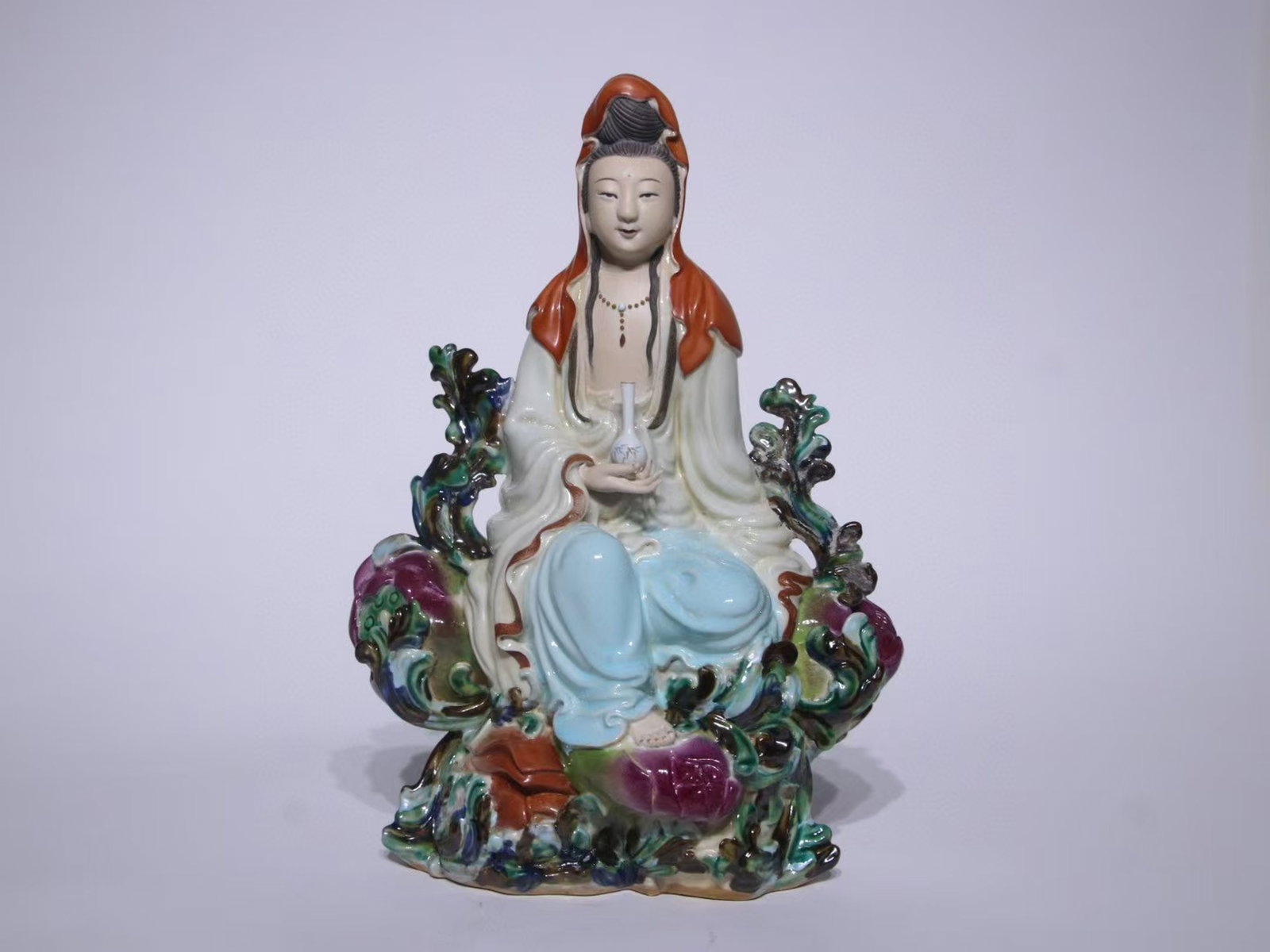 A Chinese Famille-Rose Porcelain Figure of Buddha: A Chinese Famille-Rose Porcelain Figure of Buddha. Ht. 31cm