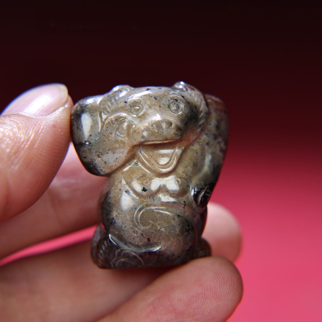 A Chinese Carved Jade Bear Statuette: A Chinese Carved Jade Bear Statuette. Ht. 3.4cm, Wd. 3cm, Th. 1.7cm, Wt. 25g