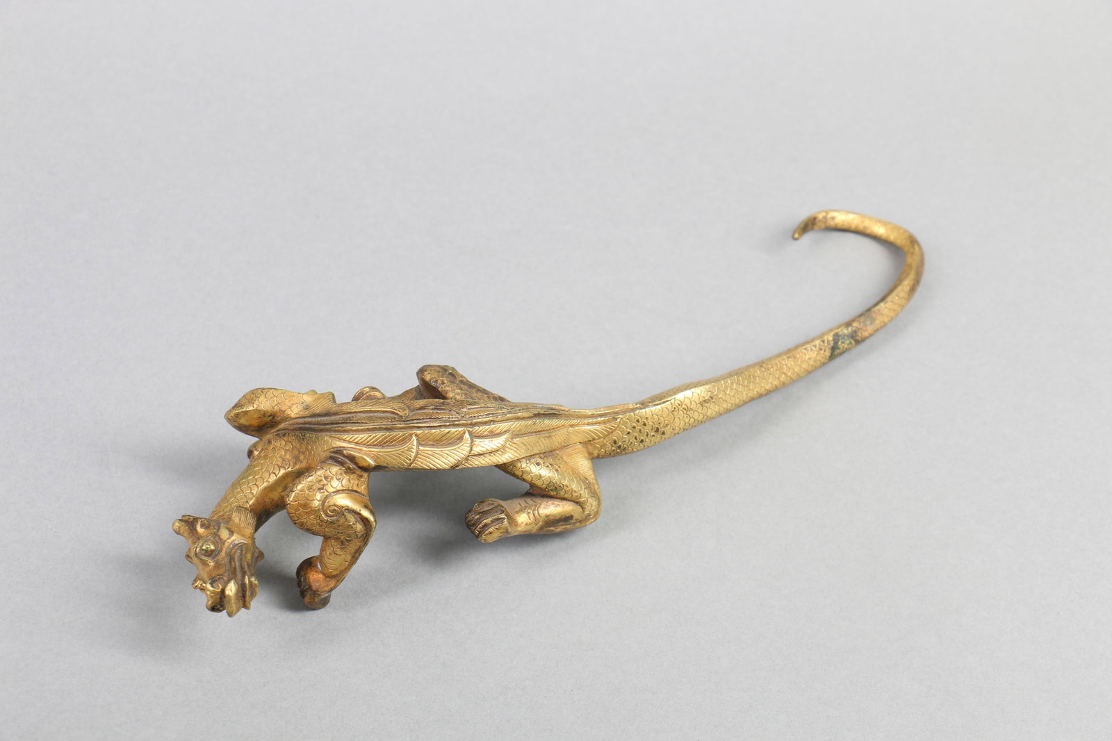 A Carved Gilt Bronze Decoration: A Carved Gilt Bronze Decoration. Lg. 26cm