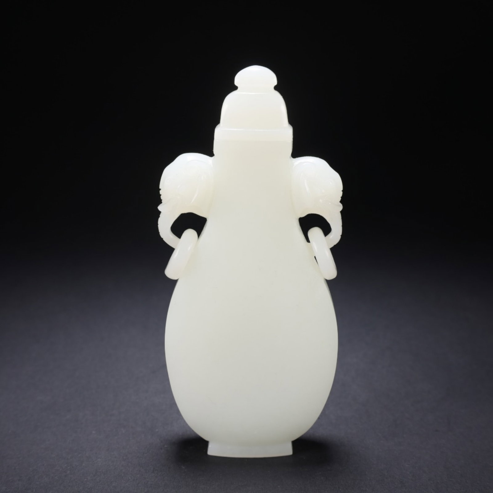 A Chinese Carved Jade Bottle with Lid: A Chinese Carved Jade Bottle with Lid. Lg. 4.8cm, Wd. 1.9cm, Ht. 11cm, Wt. 114g