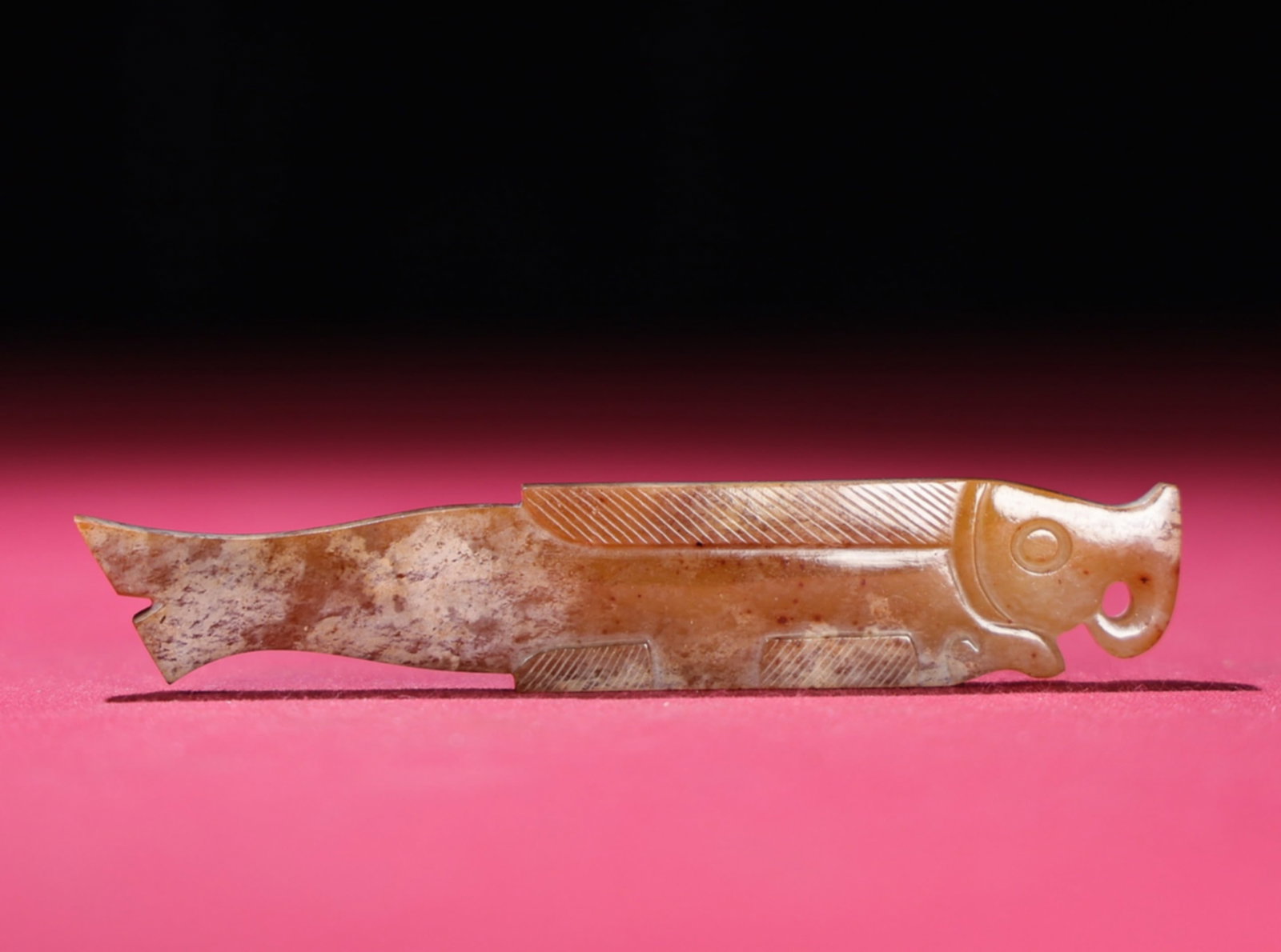 A Chinese Carved Jade Fish Pendant: A Chinese Carved Jade Fish Pendant. Lg. 9.8cm, Wd. 1.8cm, Th. 0.5cm, Wt. 21g