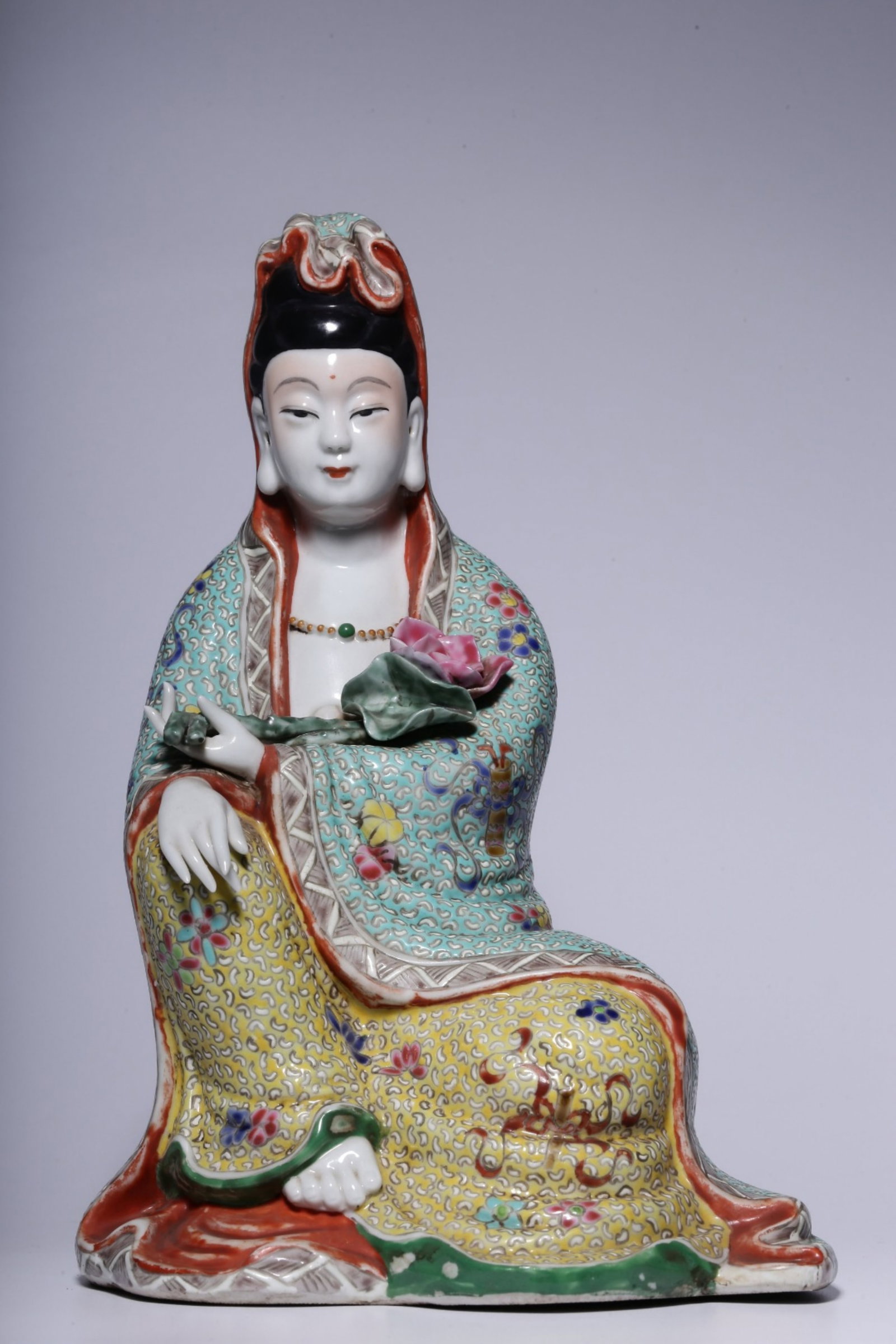 A Chinese Famille-Rose Porcelain Figure of Buddha: A Chinese Famille-Rose Porcelain Figure of Buddha. Ht. 23cm, Lg. 16cm, Wd. 12cm, Wt. 907g