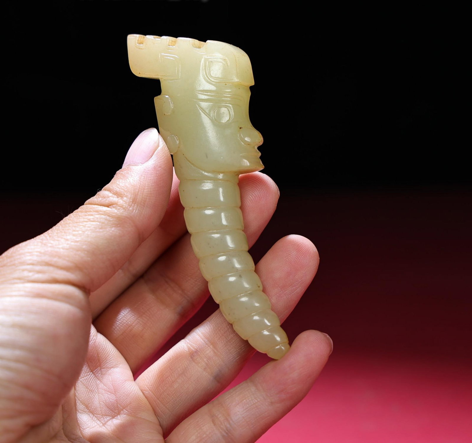 A Chinese Carved Jade Figure of Man: A Chinese Carved Jade Figure of Man. Ht. 9.9cm, Wd. 3.2cm, Th. 1.8cm, Wt. 62g