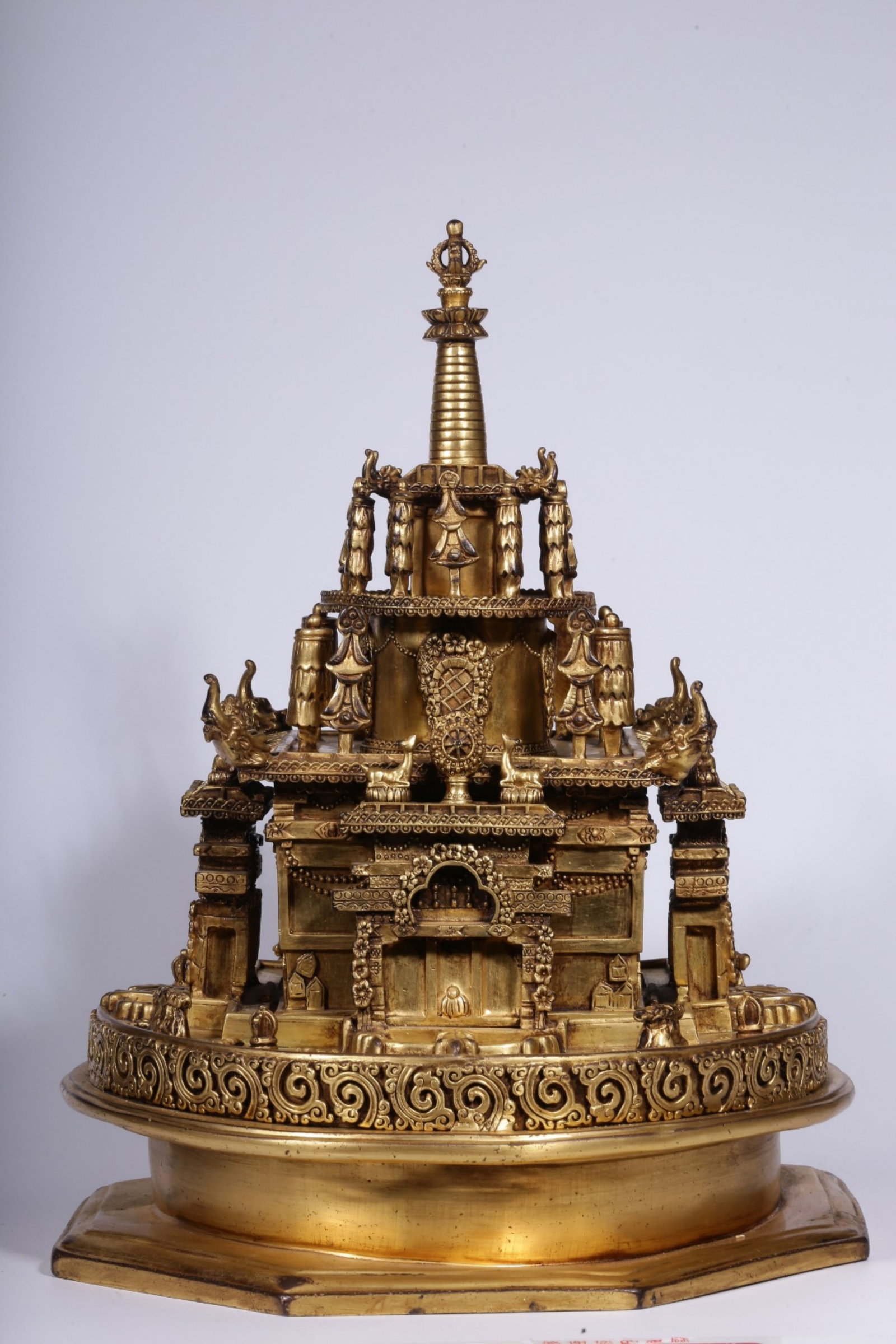A Chinese Gilt Bronze Buddhist Tower Decoration: A Chinese Gilt Bronze Buddhist Tower Decoration. Ht. 37cm, Diam. 28cm, Wt. 11850g