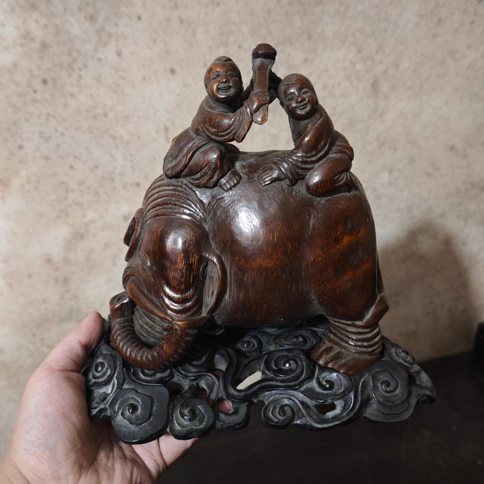 A Chinese Carved Bamboo Elephant and Boys with Ruyi Decoration: A Chinese Carved Bamboo Elephant and Boys with Ruyi Decoration. Lg. 23cm, Wd. 17cm, Ht. 25cm