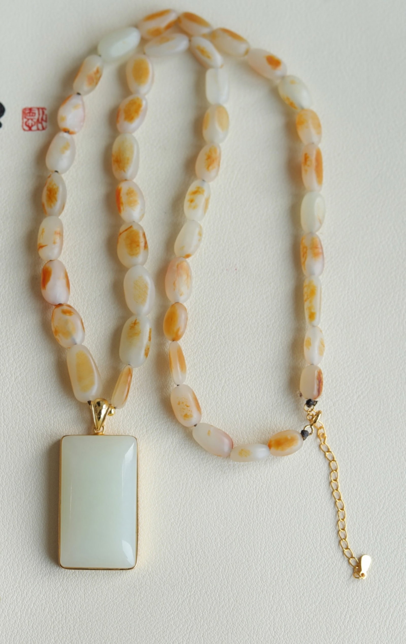 A Chinese Carved Jade Square Pendant Necklace: A Chinese Carved Jade Square Pendant Necklace. Ht. 3.6cm, Wd. 2.2cm, Multi-Sizes