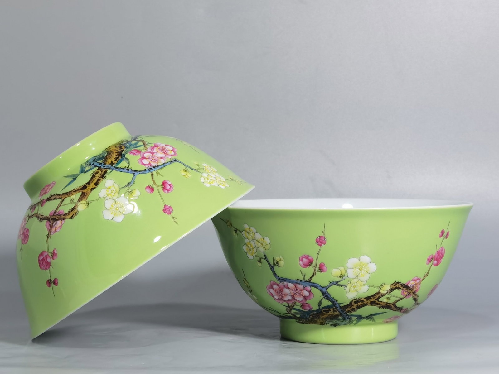 A Pair of Chinese Green Ground Enamel Glazed Porcelain Bowls: A Pair of Chinese Green Ground Enamel Glazed Porcelain Bowls. Diam. 14.6cm, Ht. 7.3cm