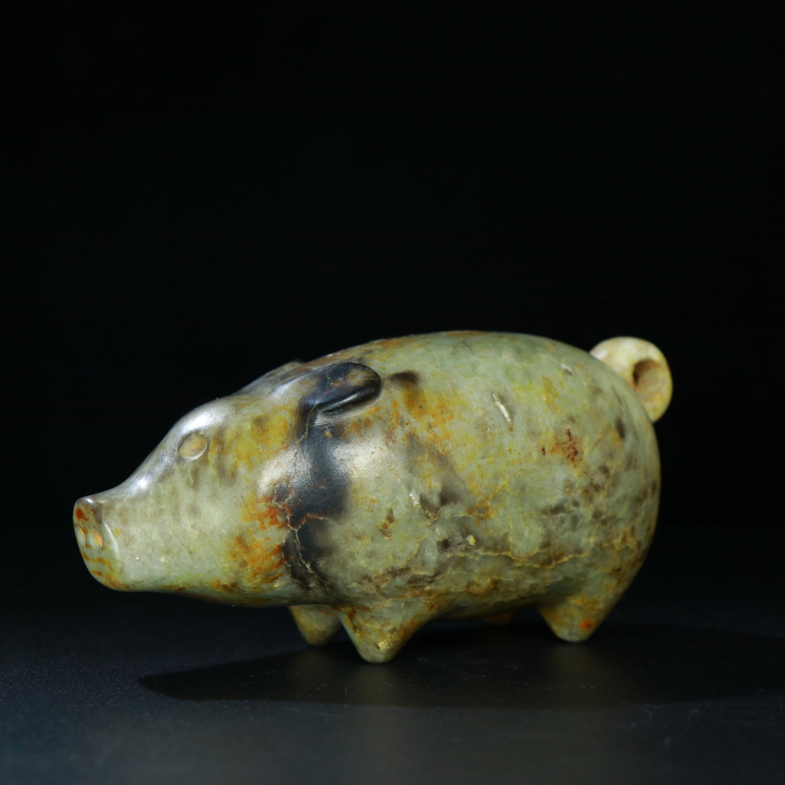 A Chinese Carved Jade Pig Statuette: A Chinese Carved Jade Pig Statuette. Lg. 13.2cm, Wd. 6.1cm, Ht. 5.5cm, Wt. 627g