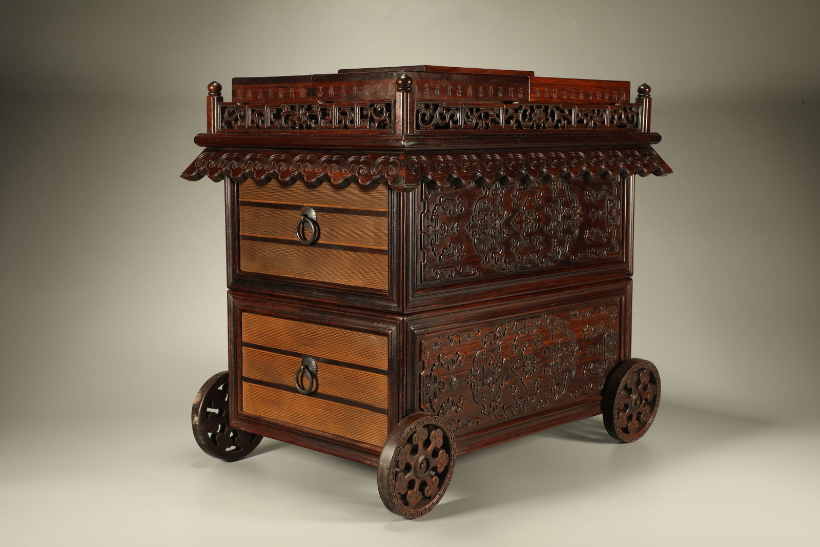A Chinese Carved Hardwood Multi-Layer Scholar Box with Lid and Wheels: A Chinese Carved Hardwood Multi-Layer Scholar Box with Lid and Wheels. Lg. 42cm, Wd. 30cm, Ht. 40cm