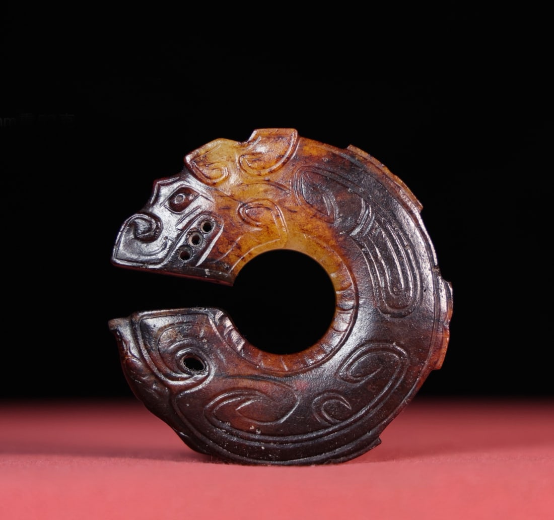 A Chinese Carved Jade Dragon Pendant: A Chinese Carved Jade Dragon Pendant. Diam. 5.9cm, Th. 0.9cm, Wt. 52g