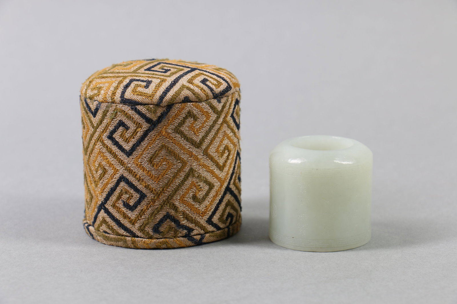 A Chinese Carved Jade Ring with Box: A Chinese Carved Jade Ring with Box. Ht.3.5cm Wd.3.5cm Lg.3.5cm Wt.58g