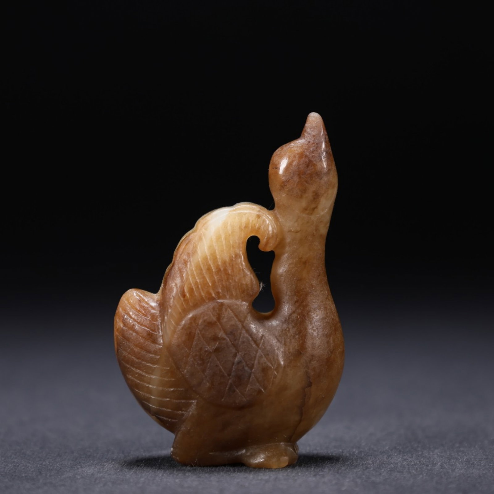 A Chinese Carved Jade Goose Statuette: A Chinese Carved Jade Goose Statuette. Lg. 3cm, Wd. 1.8cm, Ht. 4.7cm, Wt. 28g