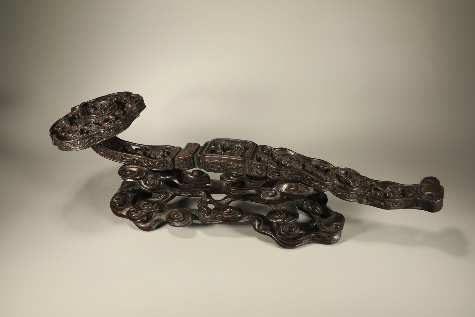 A Chinese Carved Agar-Wood Ruyi Decoration with Stand (1 of 8)