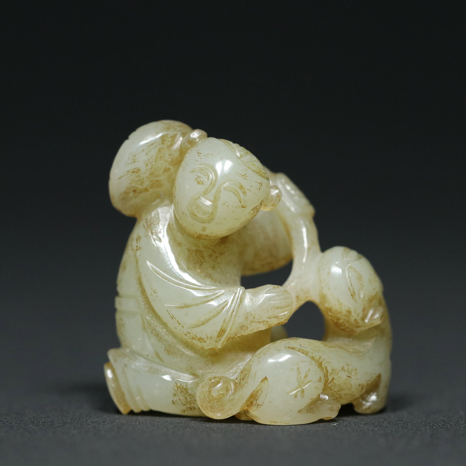 A Chinese Carved Jade Boy and Foo-Dog Statuette (1 of 9)