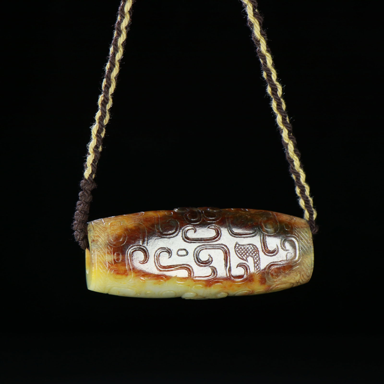 A Chinese Carved Jade Bead: A Chinese Carved Jade Bead. Lg. 6cm, Wd. 2.5cm, Diam. 1.8cm, Wt. 56g