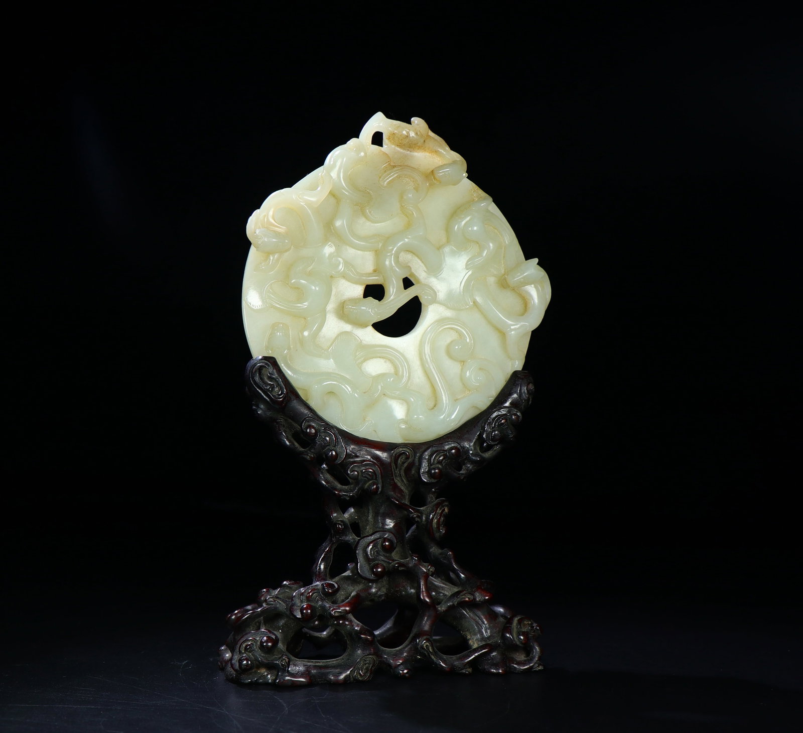 A Chinese Carved Jade Pendant with Hardwood Stand: A Chinese Carved Jade Pendant with Hardwood Stand. In General, Ht. 22cm, Wd. 12.5cm, Th. 4.5cm; The Panel, Ht. 13cm, Wt. 479g