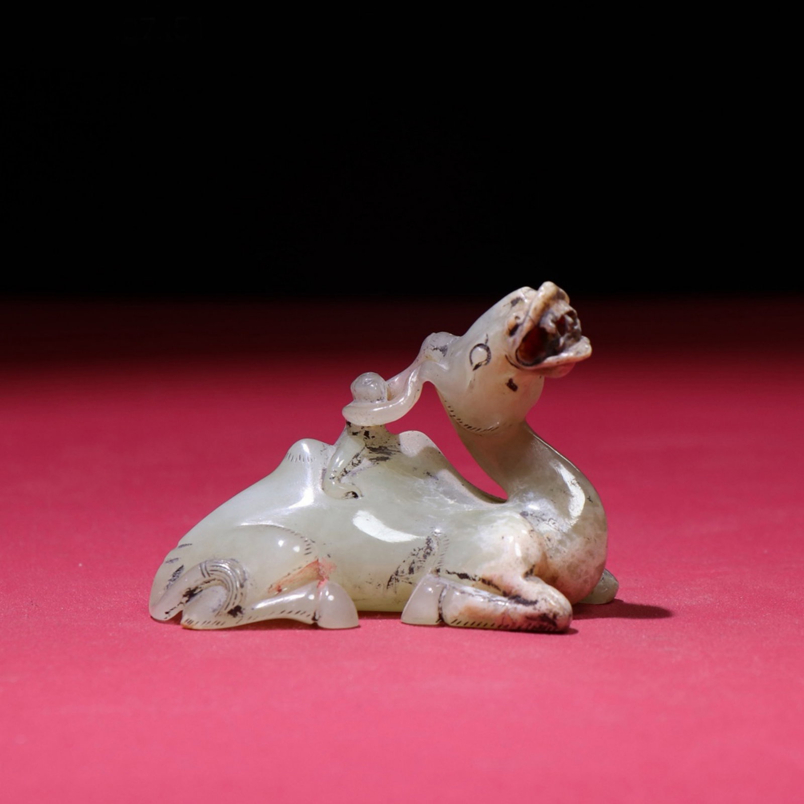 A Chinese Carved Jade Camel Statuette: A Chinese Carved Jade Camel Statuette. Lg. 7.2cm, Wd. 7.3cm, Ht. 5.1cm, Wt. 96g