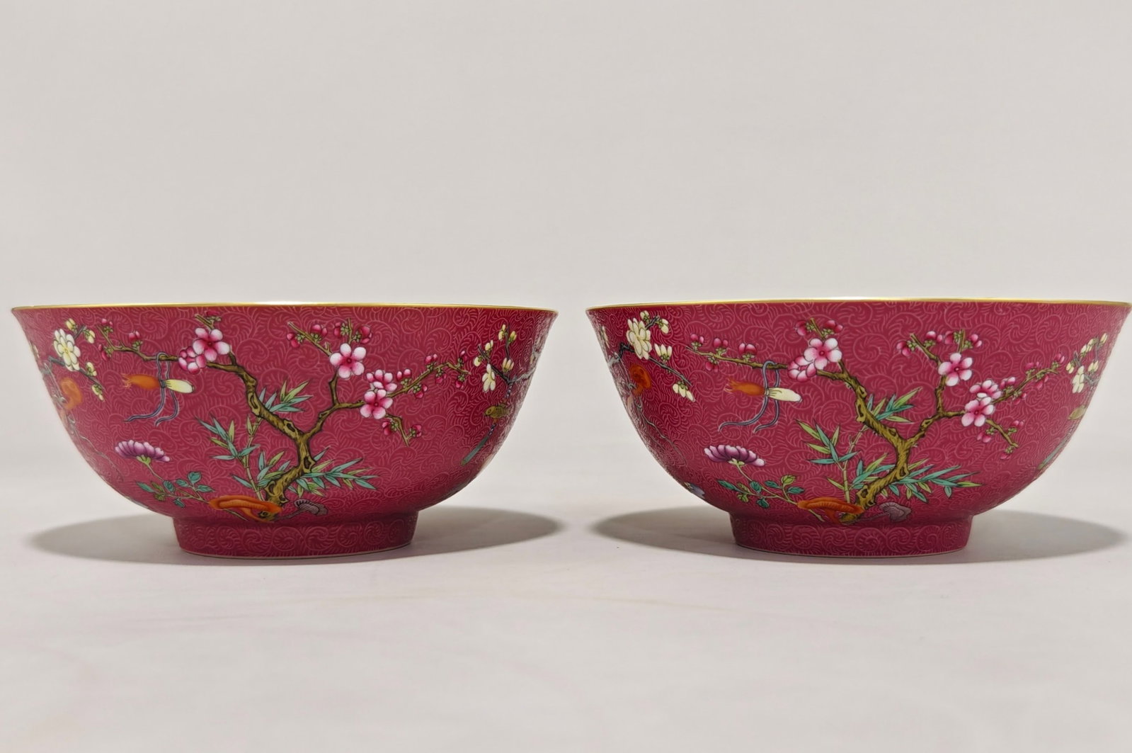 A Pair of Chinese Rouge-Red Ground Famille-Rose Porcelain Bowls: A Pair of Chinese Rouge-Red Ground Famille-Rose Porcelain Bowls. Ht. 6.7cm, Diam. 15.2cm