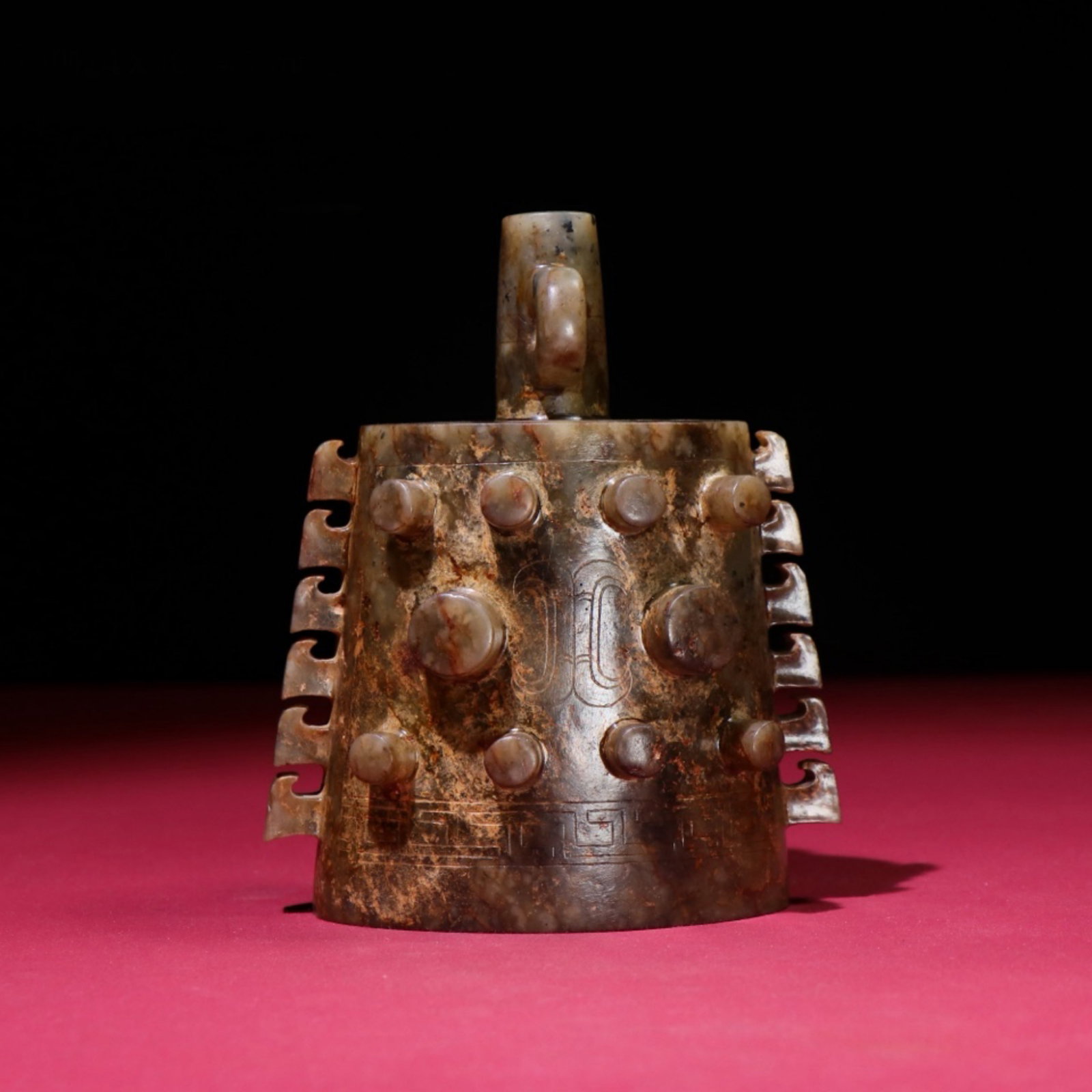 A Chinese Carved Jade Bell: A Chinese Carved Jade Bell. Ht. 12.4cm, Wd. 10.4cm, Th. 0.7cm, Wt. 553g