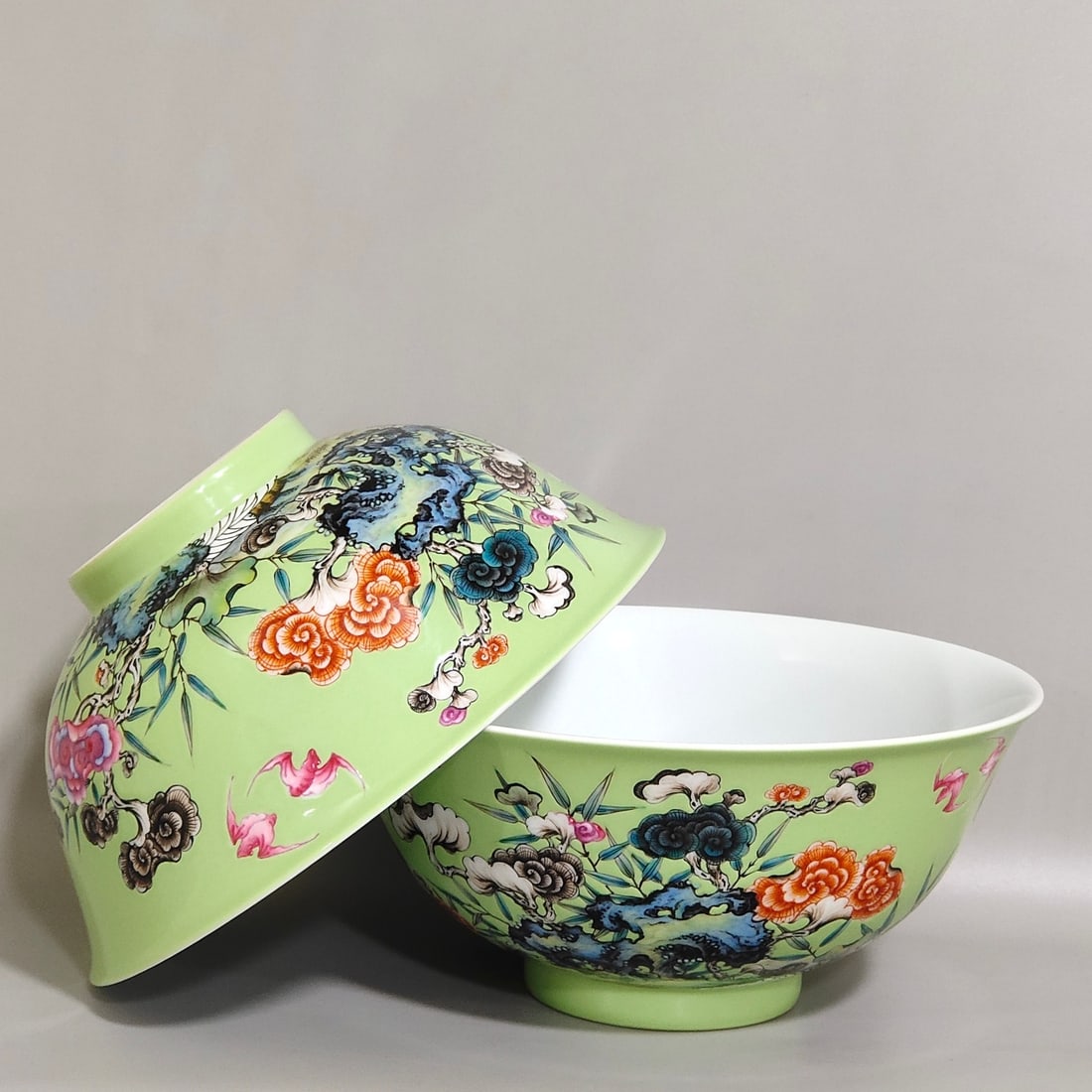 A Pair of Chinese Apple-Green Ground Famille-Rose Porcelain Bowls: A Pair of Chinese Apple-Green Ground Famille-Rose Porcelain Bowls. Ht. 7.8cm, Diam. 16.8cm