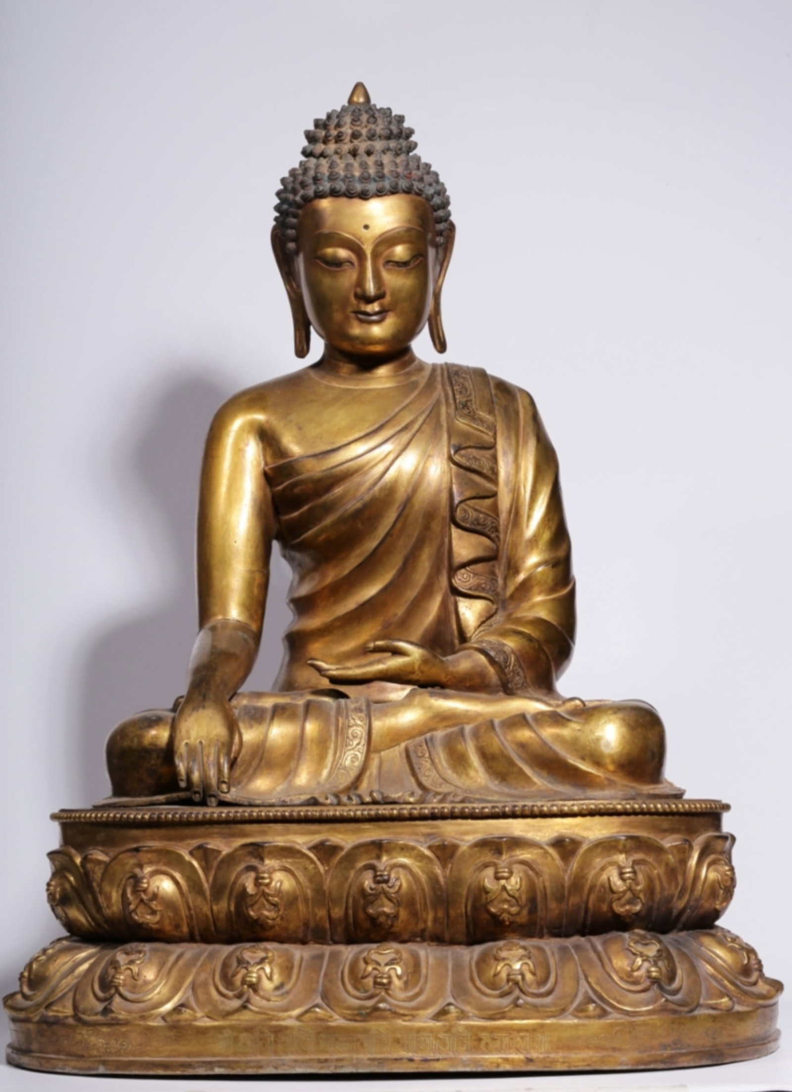A Chinese Gilt Bronze Figure of Buddha: A Chinese Gilt Bronze Figure of Buddha. Ht. 55.5cm, Lg. 42.5cm, Wd. 34.5cm, Wt. 21500g