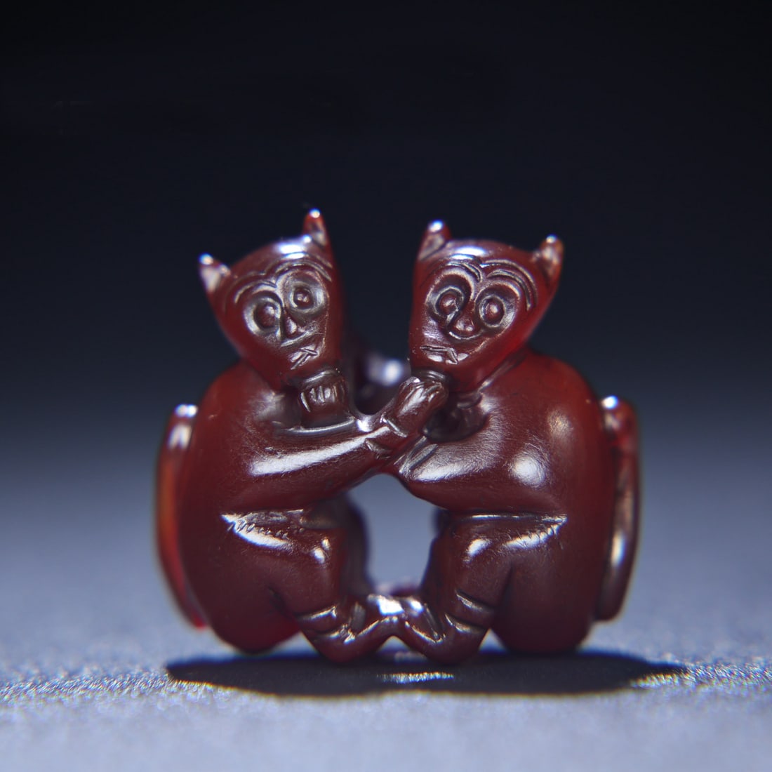 A Chinese Carved Agate Monkeys Statuette: A Chinese Carved Agate Monkeys Statuette. Ht. 3.6cm, Wd. 3.2cm, Th. 1.7cm, Wt. 23g