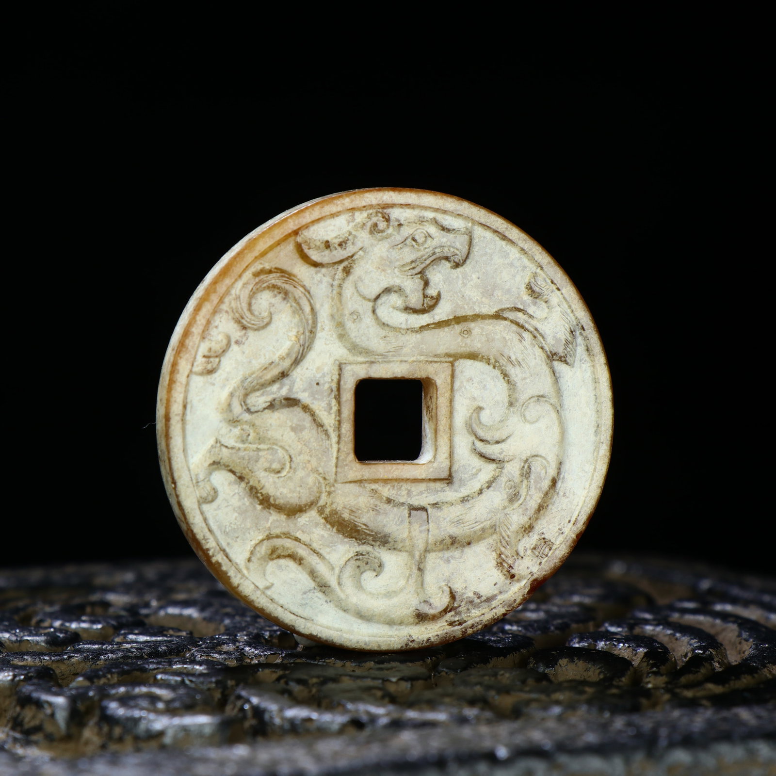 A Chinese Carved Jade Coin: A Chinese Carved Jade Coin. Diam. 4.5cm, Th. 0.5cm, Wt. 21g