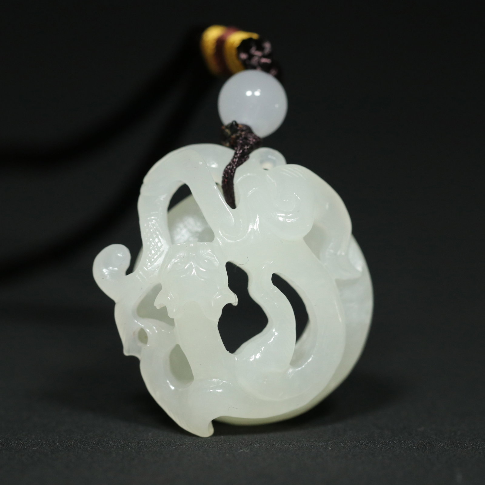 A Chinese Carved Jade Dragon Pendant: A Chinese Carved Jade Dragon Pendant. Lg. 3.5cm, Wd. 3.3cm, Th. 1.9cm, Wt. 18.5g
